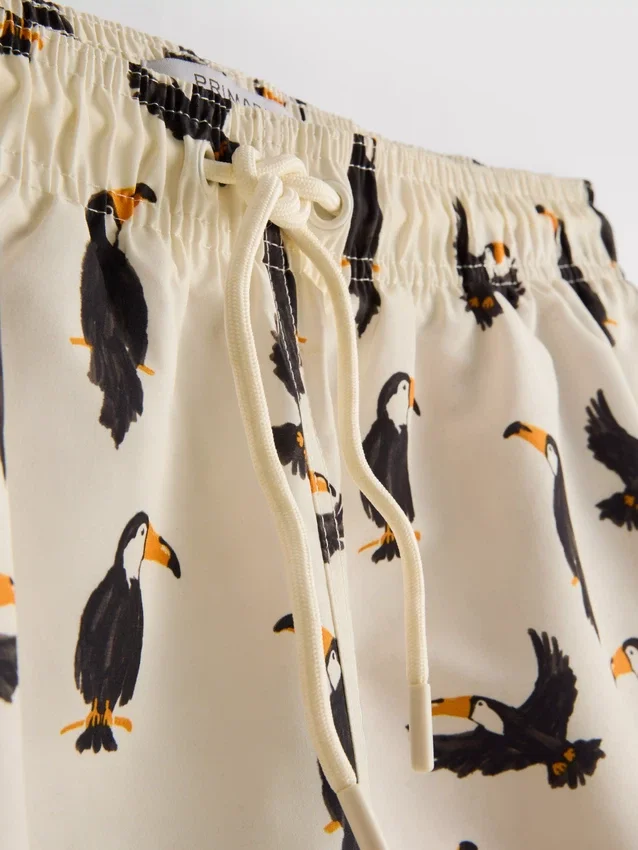 Toucan swim shorts with drawstring waistband