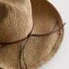 Trimmed straw cowboy hat