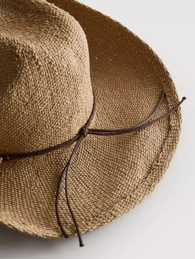 Trimmed straw cowboy hat