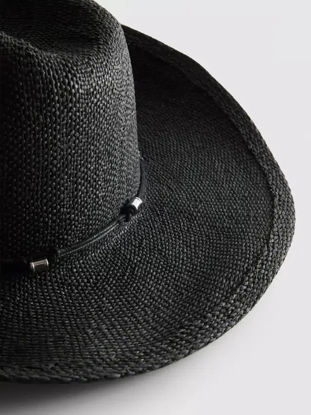 Trimmed straw cowboy hat