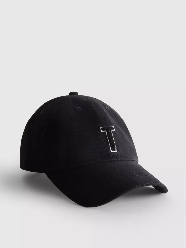 Tufted initial cap