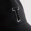 Tufted initial cap