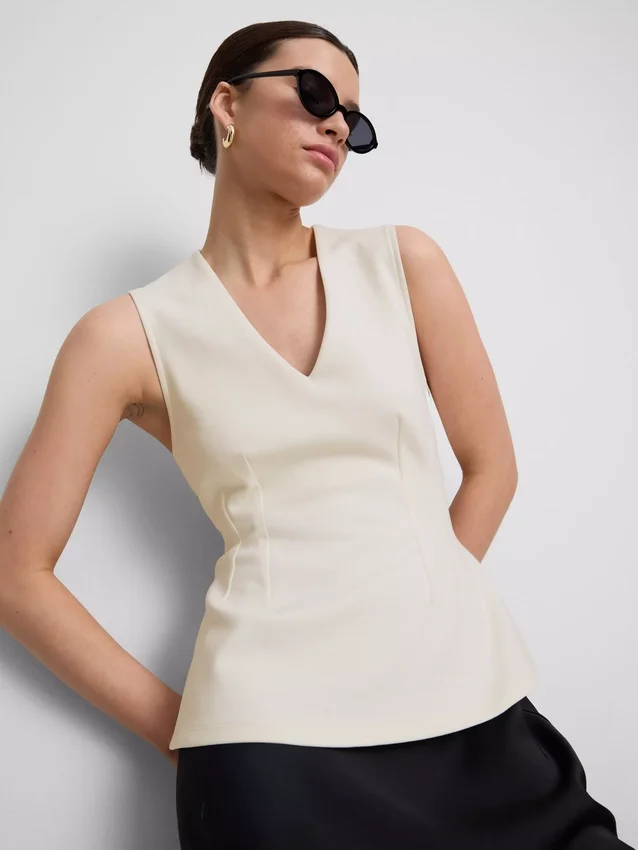 V-neck peplum sleeveless top
