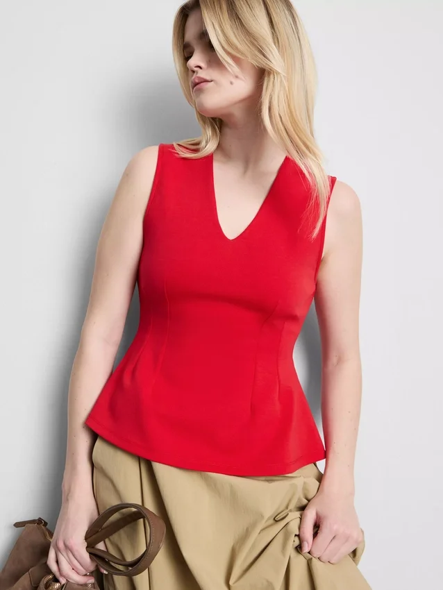 V-neck peplum sleeveless top