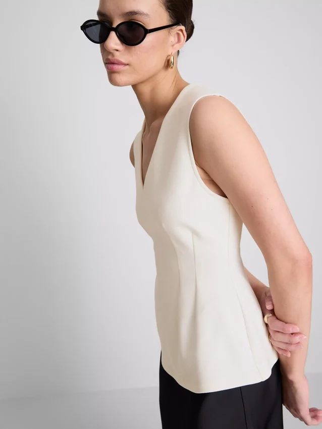 V-neck peplum sleeveless top