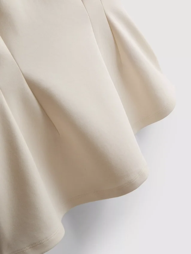 V-neck peplum sleeveless top