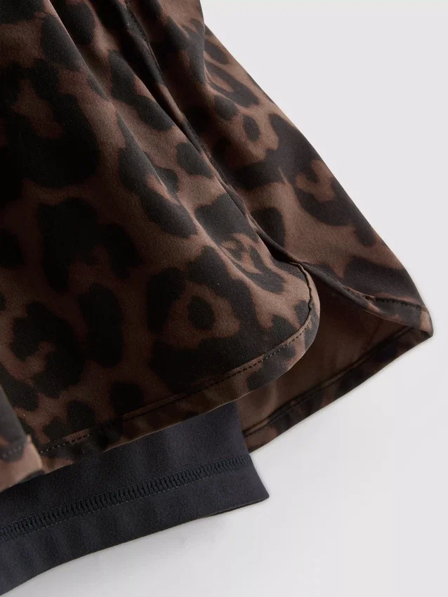 Woven leopard running shorts
