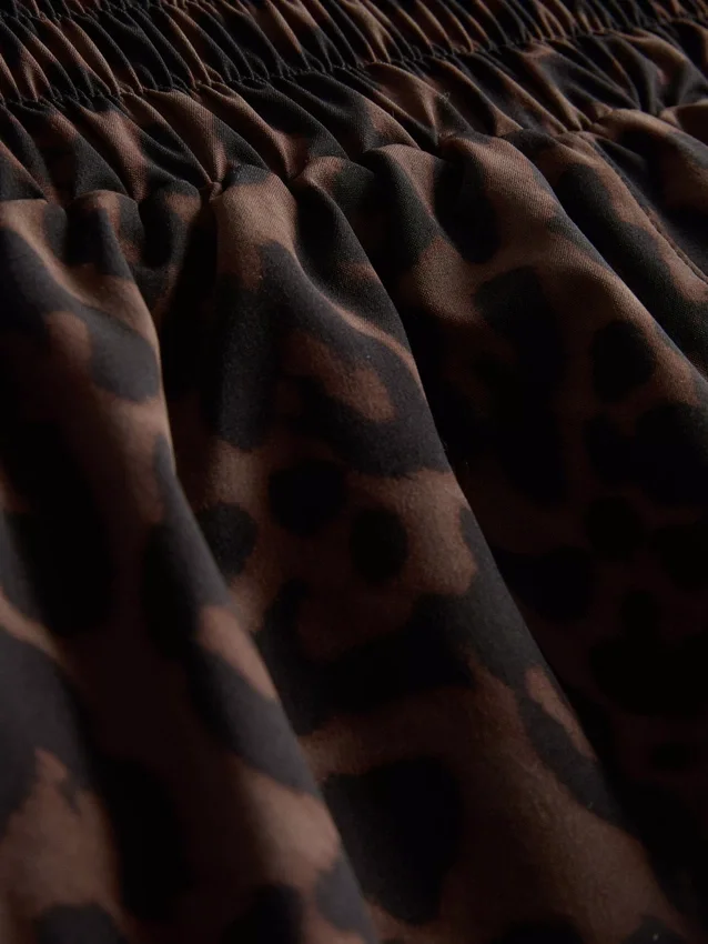 Woven leopard running shorts